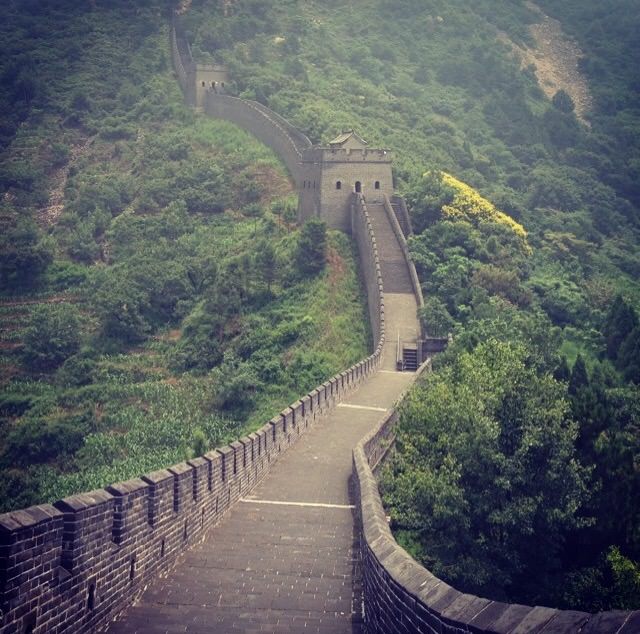 A section of the Great Wall of China winding across mountainous terrain.